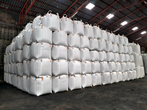 Chemical fertilizer Urea Stock pile jumbo-bag in warehouse waiting for shipment.