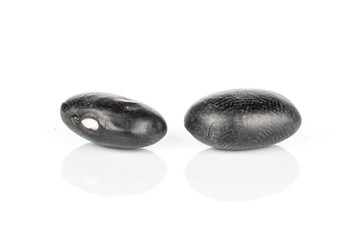 Group of two whole black bean isolated on white background