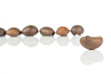 Lot of whole dark fresh coffee bean isolated on white background