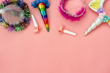 Table top view aerial image of beautiful colorful carnival festival background.Flat lay accessory object the decor for party seasonal on modern pink paper at home office desk studio.copy space.