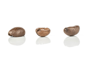 Group of three whole fresh coffee bean isolated on white background