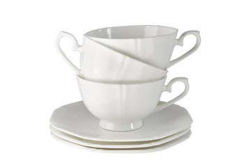 White porcelain cup with a saucer for tea or coffee, demitasse or teacup. Crockery on white background.White porcelain cup with a saucer for tea or coffee, demitasse or teacup. 