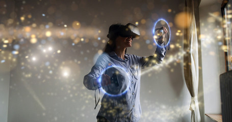 An young woman is using innovative technology vr glasses with augmented reality holograms. Concept of future, innovation, technology, holographic