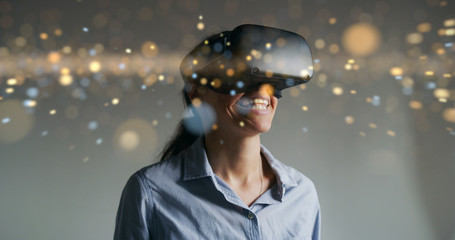 An young woman is using innovative technology vr glasses with augmented reality holograms. Concept of future, innovation, technology, holographic © Kitreel