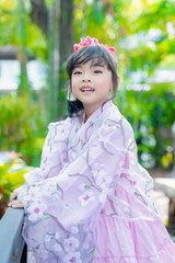 asian little girl Wearing yukata in graden