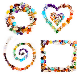 Collection of colorful semiprecious gemstones isolated on a white background.