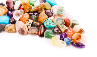 Colorful semiprecious gemstones isolated on a white background.