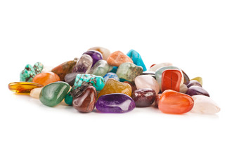 Colorful semiprecious gemstones isolated on a white background.