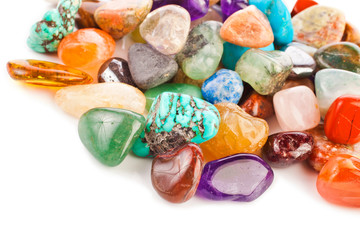 Colorful semiprecious gemstones isolated on a white background.