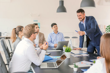 Group of business people during meeting in office