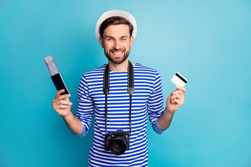 Photo of attractive guy photographer hold professional digital camera traveler buy tickets with...
