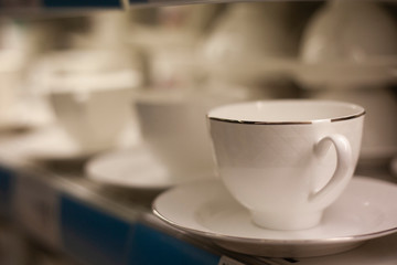 white porcelain cups in a shop