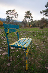 old wooden chair on the grass