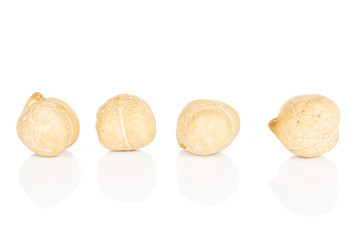 Group of four whole fresh tan chickpea isolated on white background