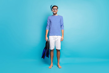 Full length photo of funny handsome guy tourist diving underwater mask breathing tube floating deep...