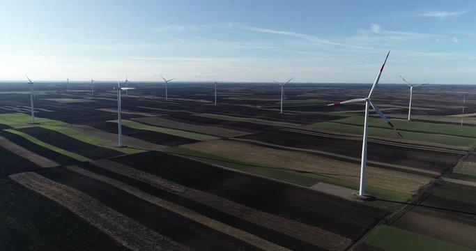 Wind Turbines in Plain Agricultural Fields in Countryside of Serbia, Aerial View. Altenative Enegry Power Concept