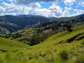 Fototapeta na wymiar Meadows and mountains under blue sky in Venezuela