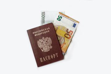 passport and money on a white background. passport of the Russian Federation, Russia and the Euro. money, 100 euros, 50 euros. money inserted in the passport. news about money. passport and banner