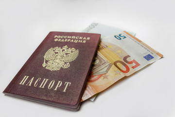 passport and money on a white background. passport of the Russian Federation, Russia and the Euro. money, 100 euros, 50 euros. money inserted in the passport. news about money. passport and banner