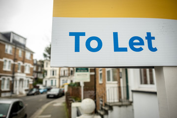 Estate Agent To Let sign on UK street