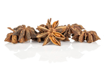 Lot of whole aromatic brown badian heap isolated on white background