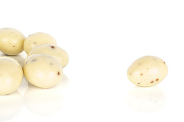 Group of six whole coated white almond nut stracciatella isolated on white background