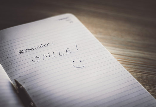 Open notebook with handwritten encouragement message.