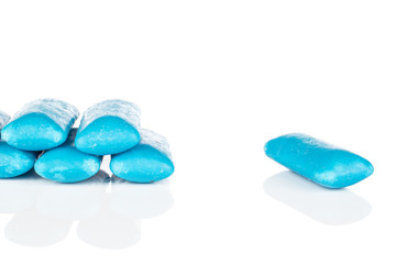 Group of six whole blue chewing gum isolated on white background