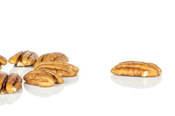 Lot of whole shelled tasty brown pecan half isolated on white background