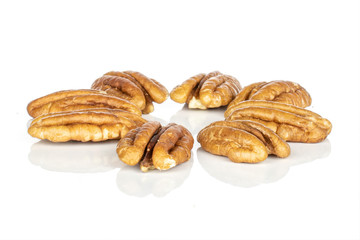 Group of eight whole tasty brown pecan half flower isolated on white background