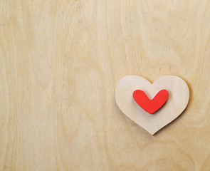 Valentine's wooden heart on a wooden background