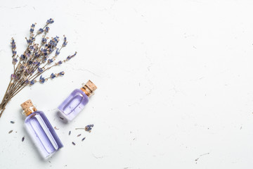 Lavender essential oil on white.