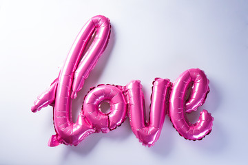 Pink balloons in the shape of the word "Love". Valentine's Day. Love concept. Holiday.