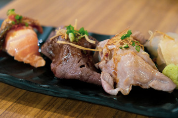 Set of sushi wagyu beef on black tray