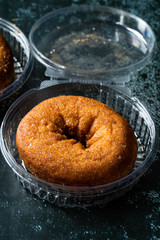 Take Away Donuts with Cinnamon in Plastic Box Package / Container.