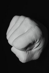 gypsum fist on the black background