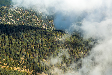 Amazing scenic aerial view of high green mountains and cloudy sunny blue sky. Landscape of Turkey. Beautiful natural photo background.