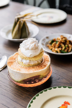 Coconut ice cream cake topping with coconut meat that serve in cut half coconut. Thai fusion dessert.