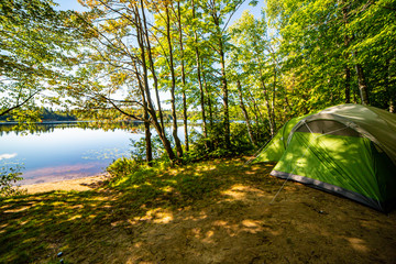 Green tent on a lake in New York State