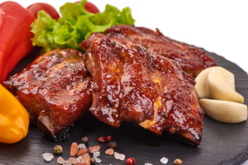 Delicious spicy marinated ribs in a bbq or tomato sauce