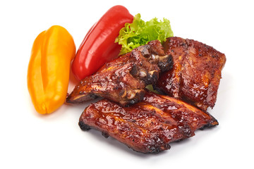Delicious spicy marinated ribs in a bbq or tomato sauce, isolated on white background
