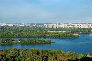 Fototapeta na wymiar Panoramic view of buildings, Kyiv-Pechersk Lavra churches, the Dnieper river and in Kyiv, Ukraine