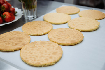 hot round cakes lay on paper