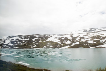 Melting lake in the Hellesylt Valley in Norway, panoramic view