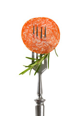 Thin salami slice and rosemary on fork