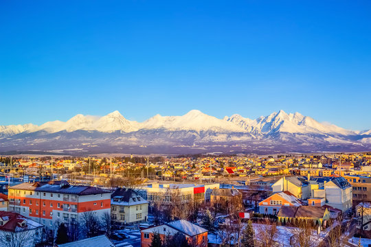 Mountains over colorful buildings and houses