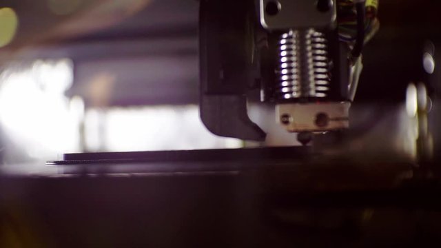 3D printer working close up. Automatic three dimensional 3d printer performs plastic. Modern 3D printer printing an object from the hot molten.shallow depth of field