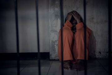 Portrait of women desperate to catch the iron prison,prisoner concept,thailand people,Hope to be...