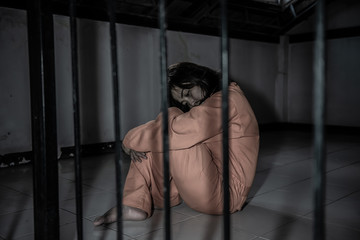 Portrait of women desperate to catch the iron prison,prisoner concept,thailand people,Hope to be...