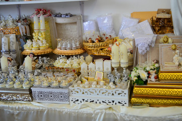 Decorated area with white wooden candle lamps and flowers